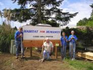Volunteers in front of Habitat for Humanity - Canby Area Chapter sign