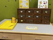 table top with repurposed card catalog as seed library