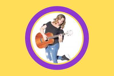 image smiling woman holding guitar