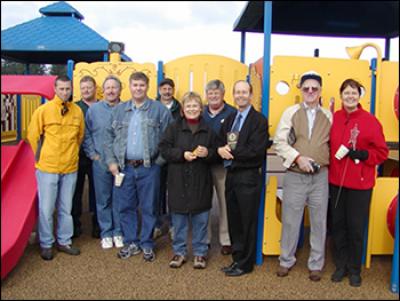 Mayor Thompson, Councilor Oliver, and the Park and Recreation Advisory Board at the playground