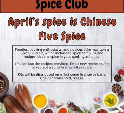 White wood grain background with bright colored spices bordering the bottom edge